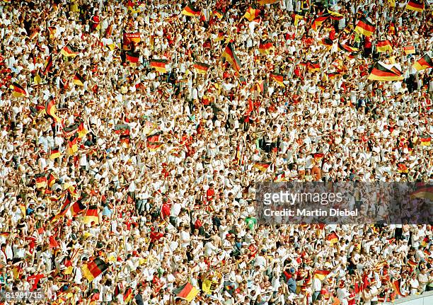 a crowd of fans at a german soccer game - fans fussball stadium stock pictures, royalty-free photos & images