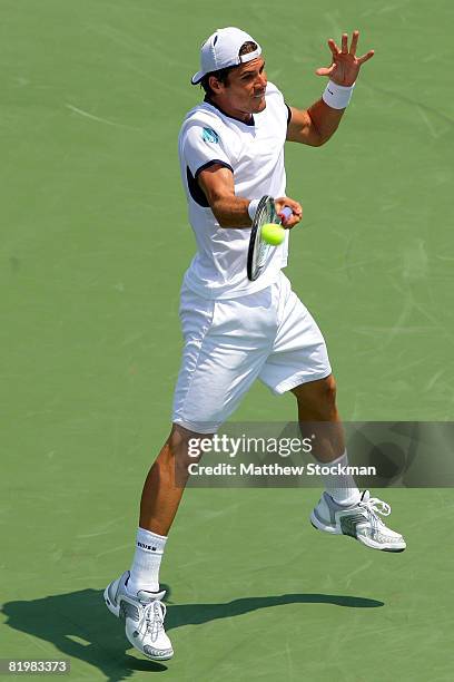 Tommy Haas of Germany returns a shot to Gilles Simon of France during the Indianapolis Tennis Championships at the Indianapolis Tennis Center July...