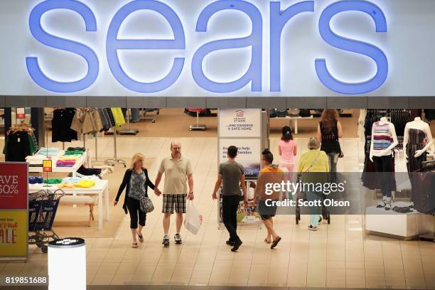 Customers shop at a Sears store in Woodfield Mall on July 20, 2017 in Schaumburg, Illinois. Sears announced today that it had agreed to sell Kenmore...