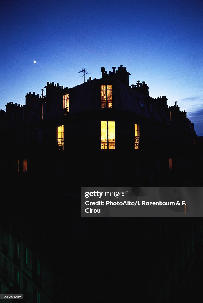 Apartment building at night, silhouette