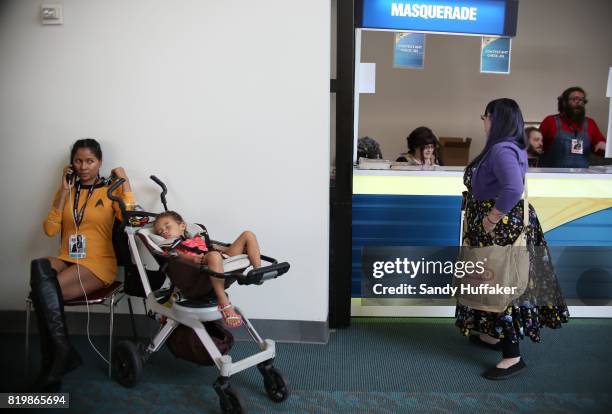 Lucinda Jones, dressed as a Star Trek charactor, sits with he son at Comic Con International on July 20, 2017 in San Diego, California. Comic Con...