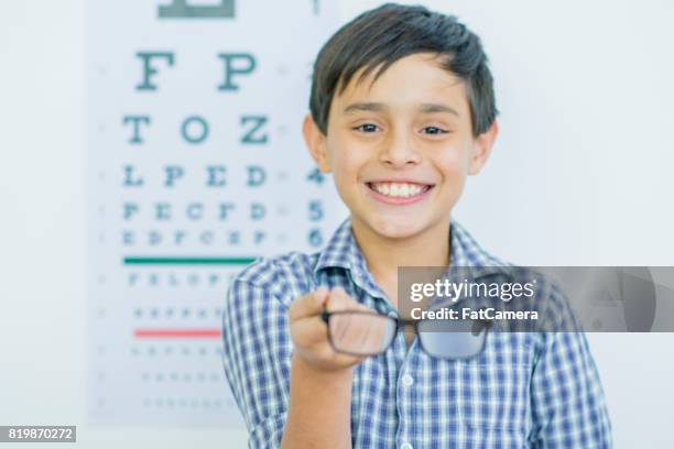 showing off glasses - myopia stock pictures, royalty-free photos & images