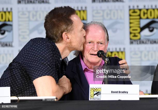 Actor Kevin Durand kisses actor David Bradley onstage at "The Strain" screening and Q+A during Comic-Con International 2017 at San Diego Convention...