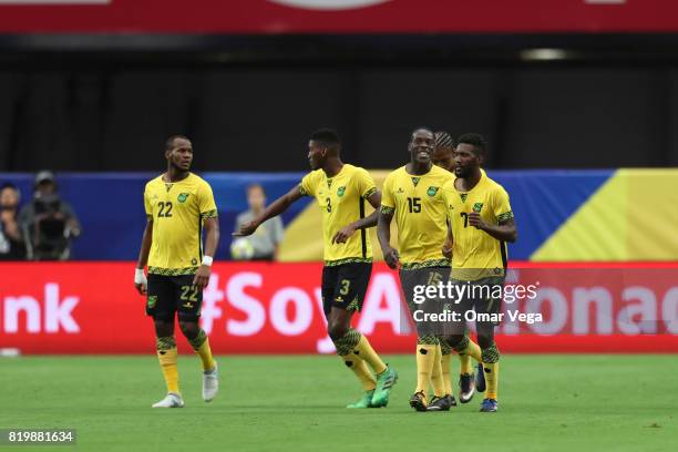 Shaun Francis of Jamaica celebrates with teammates after scoring the first goal of his team during the CONCACAF Gold Cup Quarterfinal match between...