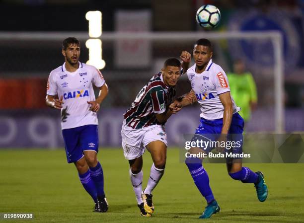 Richarlison of Fluminense struggles for the ball with Murilo Cerqueira of Cruzeiro during a match between Fluminense and Cruzeiro as part of...