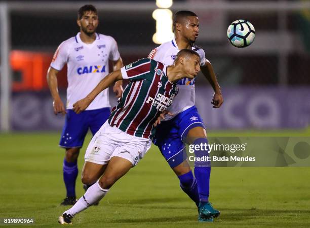 Richarlison of Fluminense struggles for the ball with Murilo Cerqueira of Cruzeiro during a match between Fluminense and Cruzeiro as part of...