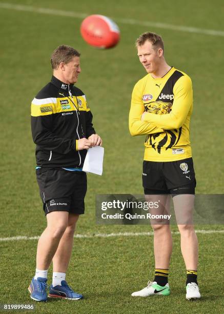 Tigers head coach Damien Hardwick speaks to Jack Riewoldt during a Richmond Tigers AFL training session at ME Bank Centre on July 21, 2017 in...