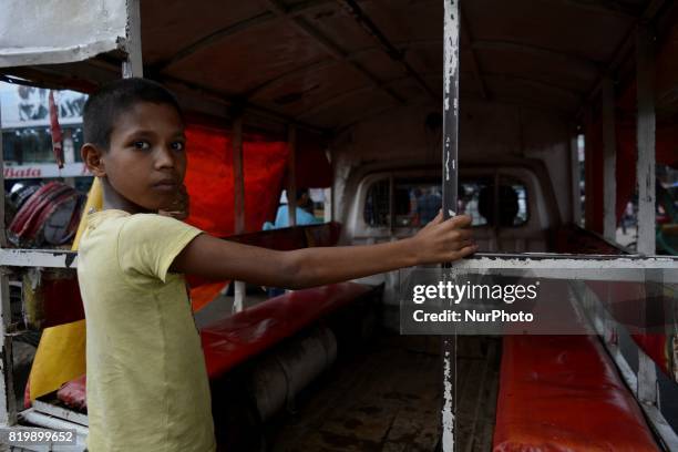 Rony , working as a human hauler driver's assistant for two weeks and he want to be a driver soon, he said.Photo has taken on Thursday, July 2017...