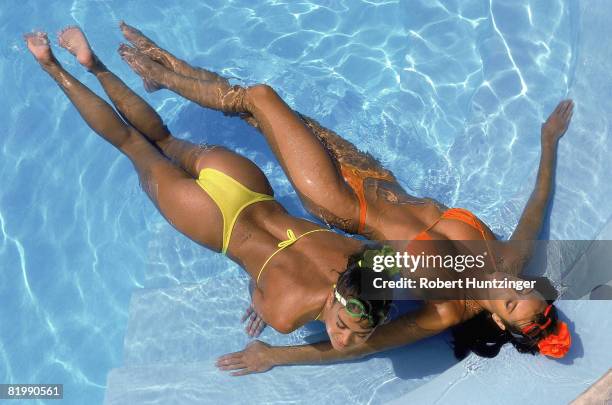 Swimsuit Issue 1990: Models Kathy Ireland and Elle Macpherson are photographed for the 1990 Sports Illustrated Swimsuit issue on January 19, 1990 on...