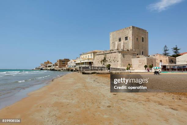 sicily, pozzallo, defense tower on the beach - climate refugee stock pictures, royalty-free photos & images