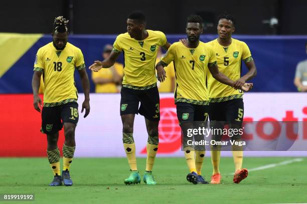 Shaun Francis of Jamaica celebrates with teammates after scoring the first goal of his team during the CONCACAF Gold Cup Quarterfinal match between...