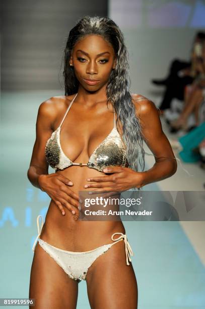 Model walks the runway during Best Talent Group Presents VICHI At Miami Swim Week Art Hearts Fashion at FUNKSHION Tent on July 20, 2017 in Miami,...