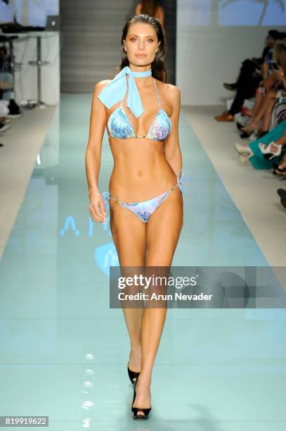 Model walks the runway during Best Talent Group Presents VICHI At Miami Swim Week Art Hearts Fashion at FUNKSHION Tent on July 20, 2017 in Miami,...