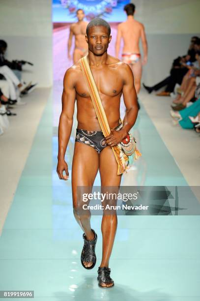 Model walks the runway Grayson Boyd at Miami Swim Week Art Hearts Fashion at FUNKSHION Tent on July 20, 2017 in Miami, Florida.