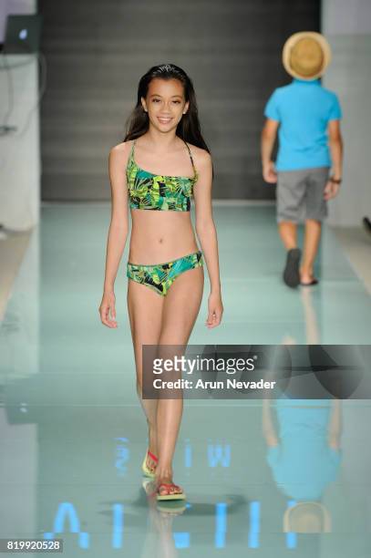 Model walks the runway during Best Talent Group Presents VICHI At Miami Swim Week Art Hearts Fashion at FUNKSHION Tent on July 20, 2017 in Miami,...
