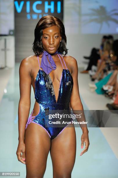 Model walks the runway during Best Talent Group Presents VICHI At Miami Swim Week Art Hearts Fashion at FUNKSHION Tent on July 20, 2017 in Miami,...