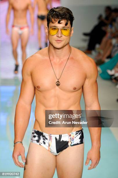 Model walks the runway Grayson Boyd at Miami Swim Week Art Hearts Fashion at FUNKSHION Tent on July 20, 2017 in Miami, Florida.