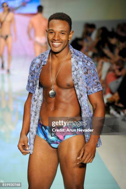 Model walks the runway Grayson Boyd at Miami Swim Week Art Hearts Fashion at FUNKSHION Tent on July 20, 2017 in Miami, Florida.