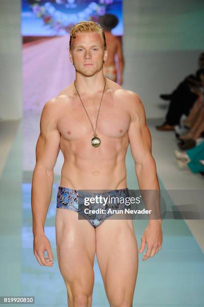 Model walks the runway Grayson Boyd at Miami Swim Week Art Hearts Fashion at FUNKSHION Tent on July 20, 2017 in Miami, Florida.