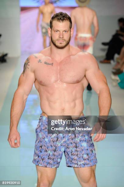 Model walks the runway Grayson Boyd at Miami Swim Week Art Hearts Fashion at FUNKSHION Tent on July 20, 2017 in Miami, Florida.