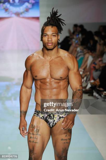 Model walks the runway Grayson Boyd at Miami Swim Week Art Hearts Fashion at FUNKSHION Tent on July 20, 2017 in Miami, Florida.