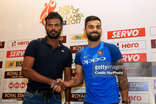 Sri Lankan cricket captain Upul Tharanaga and Indian cricket captain Virat Kohli pose for a photograph after a press conference at Colombo, Sri Lanka...