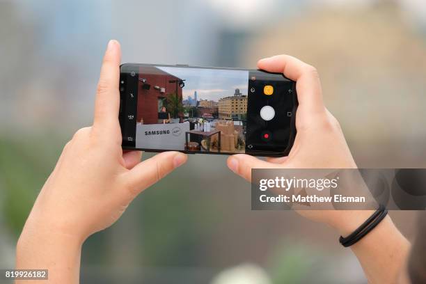 Guest takes a photo using the Samsung Galaxy S8 during Samsung's Made for Summer Series Live at 837 at Samsung 837 on July 20, 2017 in New York City.