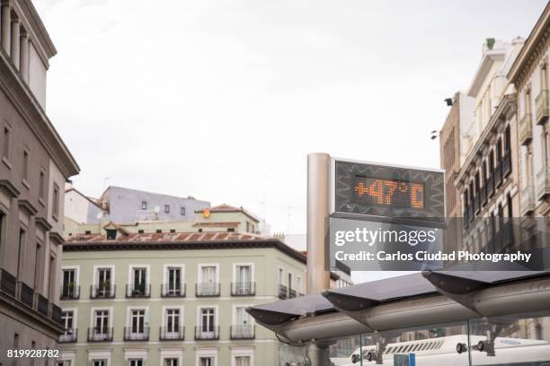 heat wave in the city center of madrid, spain - bus shelter stock pictures, royalty-free photos & images