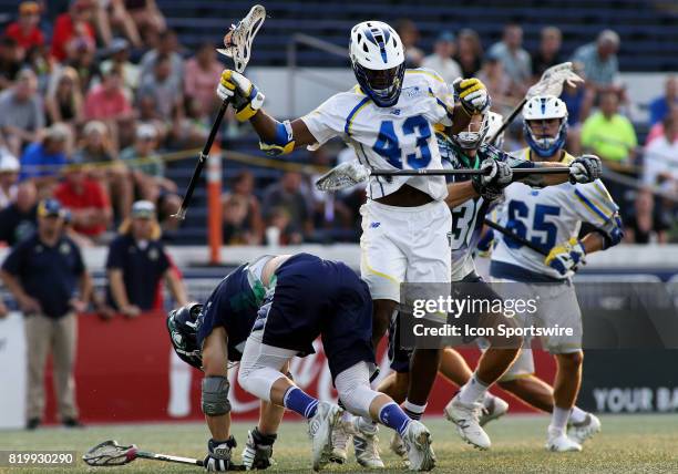 Florida Launch Mark Mcneill scoops up a loose ball over multiple Chesapeake Bayhawks defenders during a match between the Chesapeake Bayhawks and the...