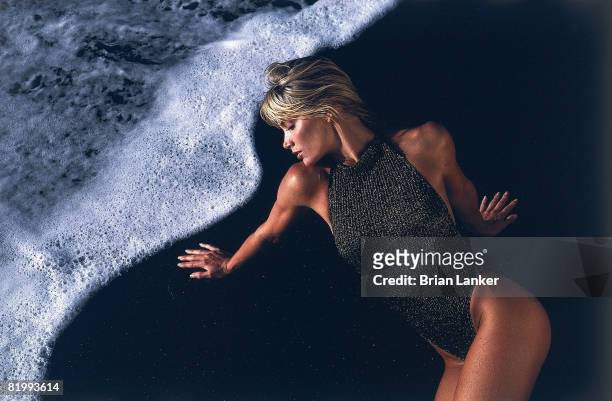 Swimsuit Issue 1986: Model Kelly Emberg poses for the 1986 Sports Illustrated swimsuit issue on November 24, 1985 in Bora-Bora, French Polynesia....