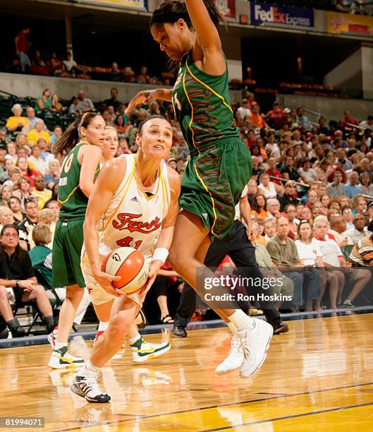 Tully Bevilaqua of the Indiana Fever looks to shoot on Ashley Robinson of the Seattle Storm at Conseco Fieldhouse on July 18, 2008 in Indianapolis,...