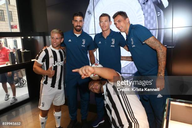 Sami Khedira, Stephan Lichtsteiner, and Mario Mandzukic pose with New York Red Bulls players DJ Bivery and Victor Miranda as Hublot Welcomes Juventus...