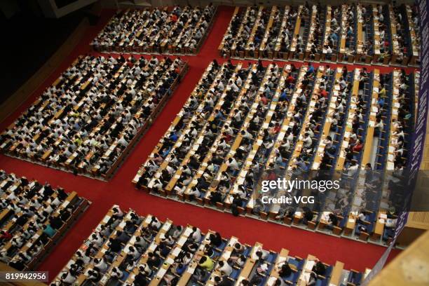 About 2,000 college students take part in a tutorial and review session for postgraduate entrance examination at a hall on July 20, 2017 in Jinan,...