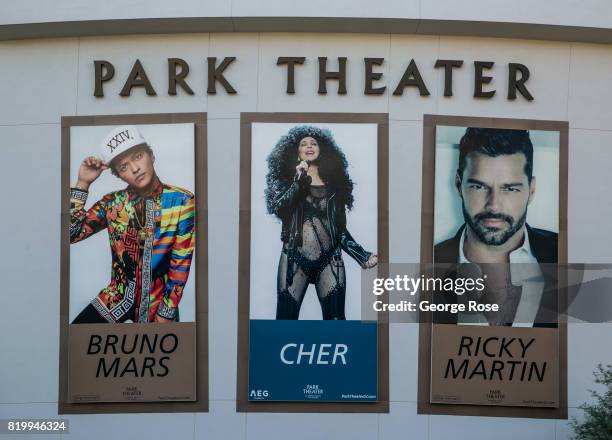 Large billboard promoting Bruno Mars, Cher, and Ricky Martin concerts at the Park Theater, located adjacent to the Monte Carlo Hotel & Casino, is...