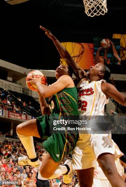 Tanisha Wright of the Seattle Storm shoots around Ebony Hoffman of the Indiana Fever at Conseco Fieldhouse on July 18, 2008 in Indianapolis, Indiana....