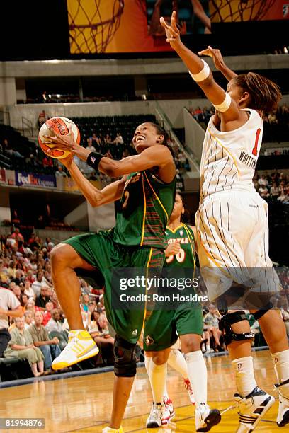 Swin Cash of the Seattle Storm looks to score on Khadijah Whittington of the Indiana Fever at Conseco Fieldhouse on July 18, 2008 in Indianapolis,...
