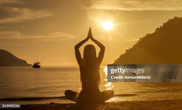 body, mind and spirit - sunrise yoga stock pictures, royalty-free photos & images