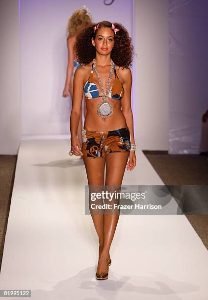 Model walks the runway at Syla by Sylvie Cachay 2009 collection fashion show during Mercedes-Benz Fashion Week Swim at the Raleigh Hotel on July 18,...