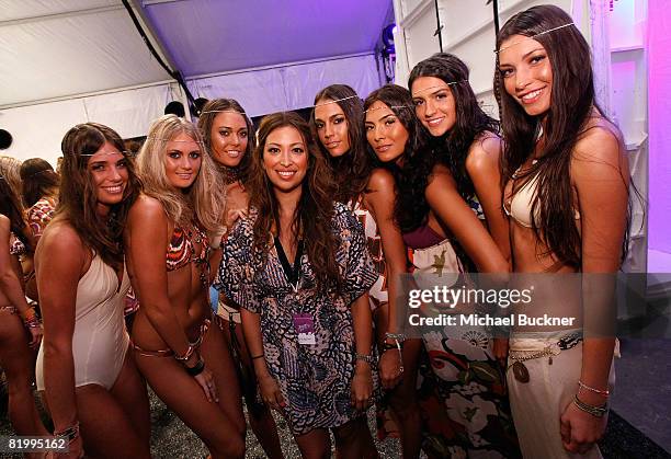 Designer Sylvie Cachay poses with models backstage at Syla by Sylvie Cachay 2009 collection fashion show during Mercedes-Benz Fashion Week Swim at...