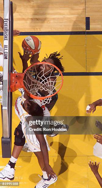 Yolanda Griffith of the Seattle Storm shoots over Ebony Hoffman of the Indiana Fever at Conseco Fieldhouse on July 18, 2008 in Indianapolis, Indiana....