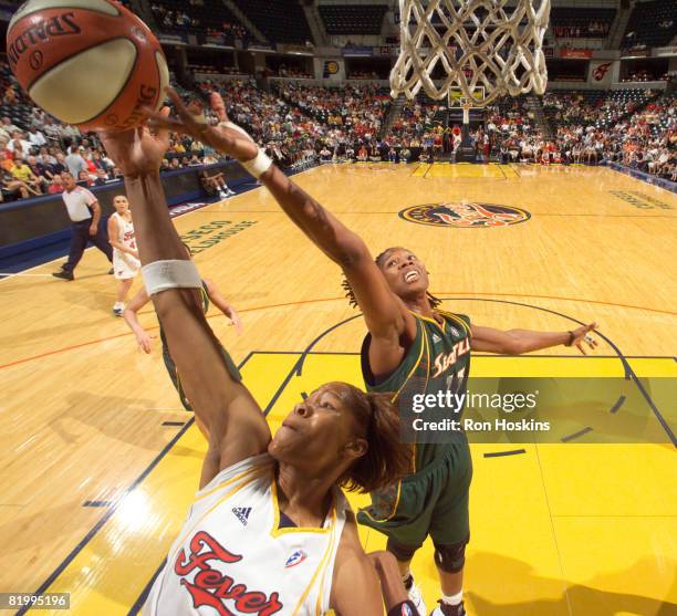 Khadijah Whittington of the Indiana Fever battles Yolanda Griffth of the Seattle Storm at Conseco Fieldhouse on July 18, 2008 in Indianapolis,...