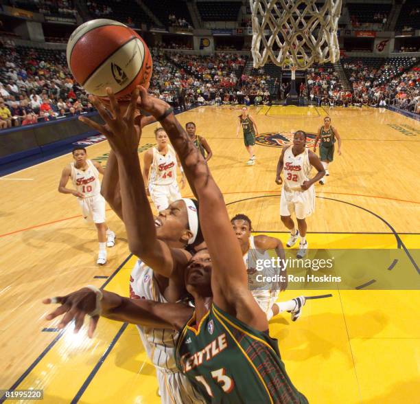 Tammy Sutton-Brown of the Indiana Fever battles Yolanda Griffth of the Seattle Storm at Conseco Fieldhouse on July 18, 2008 in Indianapolis, Indiana....