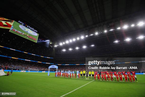 Manchester United players and Manchester City players line up during the International Champions Cup 2017 match between Manchester United and...