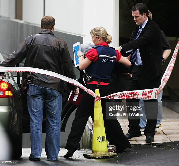 Male suspect is led out from an inner city apartment block under police custody following a four hour standoff with police and armed offender squad...