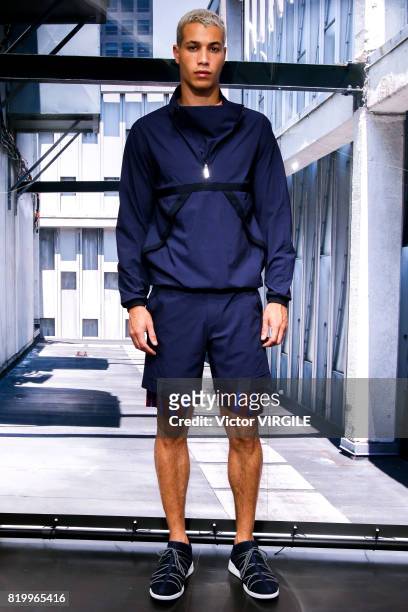 Model walks the runway at the Perry Ellis show during the NYFW: Men's July 2017 Spring Summer 2018 on July 11, 2017 in New York City.