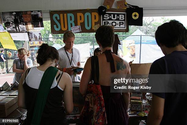 Fans browse merchandise on independent record labels in the vendor tents at the Pitchfork Music Festival at Union Park on July 18, 2008 in Chicago.