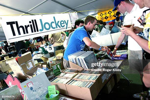 Fans browse merchandise on independent record labels in the vendor tents at the Pitchfork Music Festival at Union Park on July 18, 2008 in Chicago.