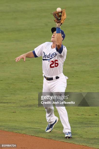 Chase Utley of the Los Angeles Dodgers makes a catch during the the game between the Atlanta Braves and the Los Angeles Dodgers at Dodger Stadium on...