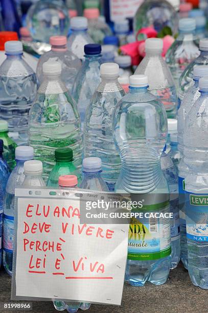 Paper reading "Eluana must live because she is alive" is glued to a bottle of water in Piazza del Duomo on July 18 2008, after the court gave the...
