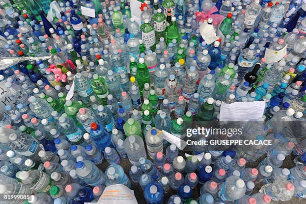 Teddy bear and messages are glued to bottles of water in Piazza del Duomo on July 18 2008, after the court gave the go-ahead for doctors to halt...